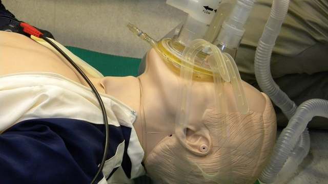 A continuous positive airway pressure mask fitted on a person