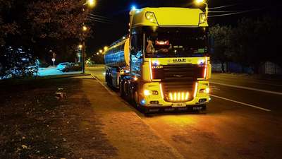 A truck cab lit up at night