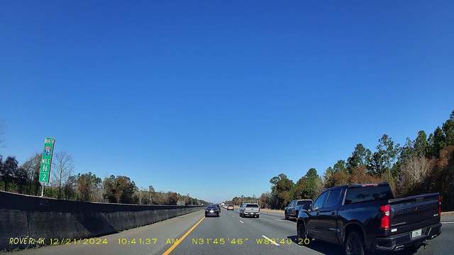 A highway seen through a dash camera