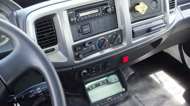Switches on the dash inside a Hino truck cab