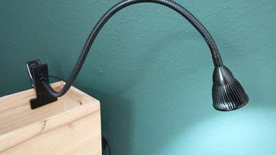 An LED gooseneck lamp, the kind of light you can aim at a page