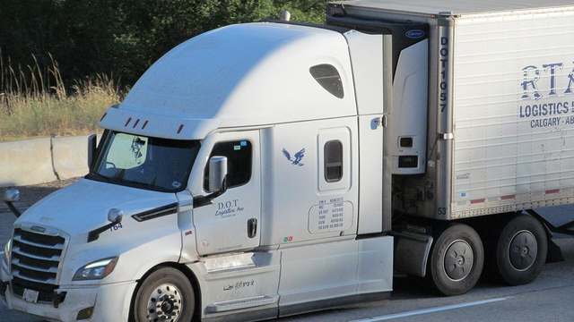 A Freightliner with a refrigerated trailer on I-90 near Spokane