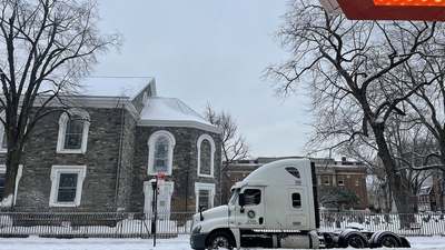 A semi truck parked in the snow