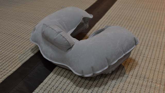 A U-shaped travel pillow on a white background